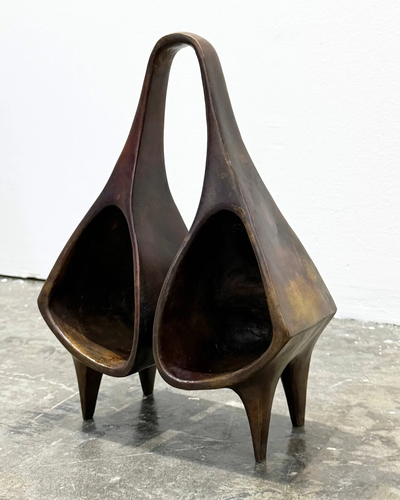 The cast bronze ogene standing on four tapered legs