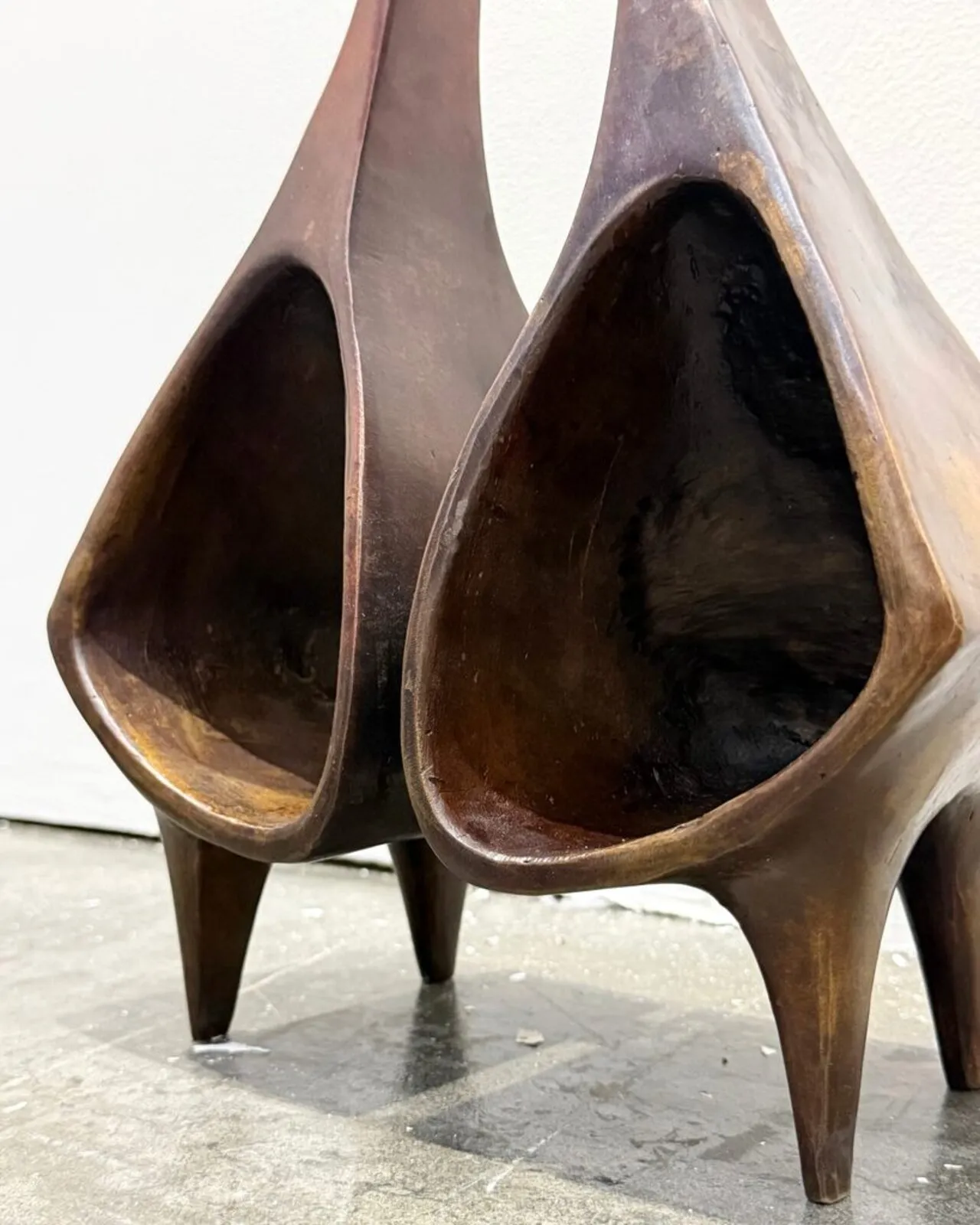 Close view of the two hollow bells and their patinated interiors