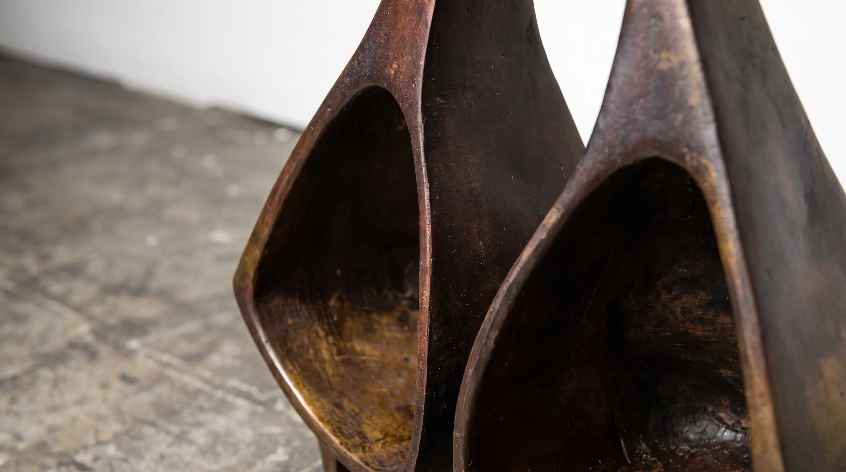Close crop of the bell mouths and the seam where the two halves meet