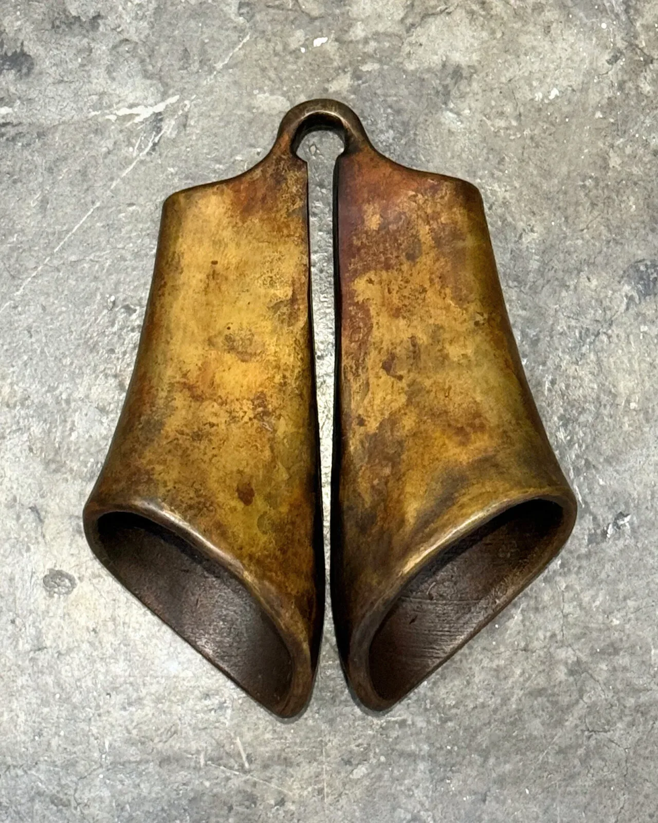 The bells from above, joined at the ring, their mouths turned outward